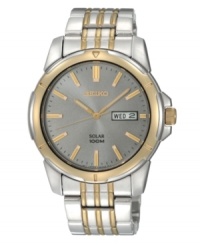 Embrace contemporary and classic style with this energy-efficient watch by Seiko. Brushed and polished two-tone stainless steel bracelet and round case, 39mm. Gunmetal dial features applied gold tone stick indices, minute track, day and date window at three o'clock, LumiBrite hands and logo. Solar-powered quartz movement. Water resistant to 100 meters. Three-year limited warranty. Embrace contemporary and classic style with this energy-efficient watch by Seiko. Brushed and polished two-tone stainless steel bracelet and round case, 39mm. Gunmetal dial features applied gold tone stick indices, minute track, day and date window at three o'clock, LumiBrite hands and logo. Solar-powered quartz movement. Water resistant to 100 meters. Three-year limited warranty.