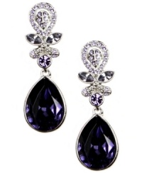 Polished, poised and stunningly purple. Givenchy's regal drop earrings combine pear-cut violet crystals with lavender-hued crystal accents. Setting and clip-on backing crafted in silver tone mixed metal. Approximate drop: 1-1/2 inches. Polished, poised and stunningly purple. Givenchy's regal drop earrings combine pear-cut violet crystals with lavender-hued crystal accents. Setting and clip-on backing crafted in silver tone mixed metal. Approximate drop: 1-1/2 inches.