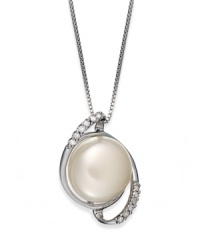Capture a classic style. This sterling silver necklace suspends a cultured freshwater button pearl (11-12 mm) surrounded by swirls of diamonds for refined elegance. Approximate length: 18 inches. Approximate drop length: 3/4 inch. Approximate drop width: 1/2 inch. Capture a classic style. This sterling silver necklace suspends a cultured freshwater button pearl (11-12 mm) surrounded by swirls of diamonds for refined elegance. Approximate length: 18 inches. Approximate drop length: 3/4 inch. Approximate drop width: 1/2 inch.