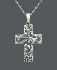 Divine style and breathtaking design. Genevieve & Grace pendant features a beautiful floral-patterned cross accented by glittering marcasite. Setting and chain crafted in sterling silver. Approximate length: 18 inches. Approximate drop length: 1-1/4 inches. Approximate drop width: 3/4 inch. Divine style and breathtaking design. Genevieve & Grace pendant features a beautiful floral-patterned cross accented by glittering marcasite. Setting and chain crafted in sterling silver. Approximate length: 18 inches. Approximate drop length: 1-1/4 inches. Approximate drop width: 3/4 inch.