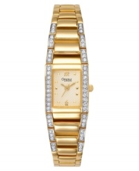 A chic style from Caravelle by Bulova. Goldtone mixed metal bracelet and case with crystal detailing. Crystal-accented bezel. Goldtone dial with logo, goldtone numerals at 12 and 6 o'clock and square markers. Quartz movement. Water resistant to 30 meters. Three-year limited warranty. A chic style from Caravelle by Bulova. Goldtone mixed metal bracelet and case with crystal detailing. Crystal-accented bezel. Goldtone dial with logo, goldtone numerals at 12 and 6 o'clock and square markers. Quartz movement. Water resistant to 30 meters. Three-year limited warranty.