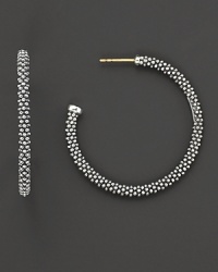 Signature sterling silver Caviar™ beaded earrings, designed by Lagos. Signature sterling silver Caviar™ beaded earrings, designed by Lagos.