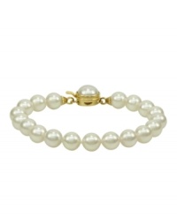 Elegance is a lustrous string of pearls. Majorica's bracelet of white organic man-made pearls (8 mm) features an 18k gold over sterling silver push-lock clasp. Approximate length: 7 inches. Elegance is a lustrous string of pearls. Majorica's bracelet of white organic man-made pearls (8 mm) features an 18k gold over sterling silver push-lock clasp. Approximate length: 7 inches.