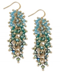 Tasteful in turquoise. Add a vibrant waterfall of color with these cascade cluster earrings from c.A.K.e. by Ali Khan. Crafted in gold tone mixed metal, they feature tonal turquoise color glass beads. Approximate length: 1-3/4 inches. Tasteful in turquoise. Add a vibrant waterfall of color with these cascade cluster earrings from c.A.K.e. by Ali Khan. Crafted in gold tone mixed metal, they feature tonal turquoise color glass beads. Approximate length: 1-3/4 inches.