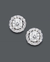 Style fit for a star. Wear this sparkling pair for any occasion, but be prepared to turn heads. Round-cut diamonds (1-1/2 ct. t.w.) shine amongst a halo of diamond accents. Crafted in 14k white gold. Approximate diameter: 8-2/10 mm. Style fit for a star. Wear this sparkling pair for any occasion, but be prepared to turn heads. Round-cut diamonds (1-1/2 ct. t.w.) shine amongst a halo of diamond accents. Crafted in 14k white gold. Approximate diameter: 8-2/10 mm.