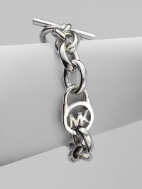 A sleek silvertone design with an iconic logo embellished lock on a chain link. Silvertone metalLength, about 8Toggle closureImported A sleek silvertone design with an iconic logo embellished lock on a chain link. Silvertone metalLength, about 8Toggle closureImported