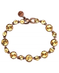 Shine like the sun. Givenchy's flex bracelet is crafted from brown gold-tone mixed metal. Light Colorado topaz accents add sparkle. Approximate length: 7-3/8 inches. Shine like the sun. Givenchy's flex bracelet is crafted from brown gold-tone mixed metal. Light Colorado topaz accents add sparkle. Approximate length: 7-3/8 inches.