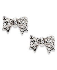 Wrap up your look with these darling bow studs from Juicy Couture. Shimmering pave crystals take the look to a gorgeous new level. Crafted in silver tone mixed metal. Approximate diameter: 1/2 inch. Wrap up your look with these darling bow studs from Juicy Couture. Shimmering pave crystals take the look to a gorgeous new level. Crafted in silver tone mixed metal. Approximate diameter: 1/2 inch.
