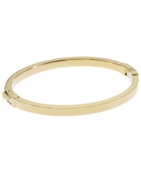 Dress up your look with a simple layer. Michael Kors thin polished bangle looks great solo, but is perfect for stacking! Crafted in gold tone mixed metal. Approximate width: 1/8 inch. Approximate diameter: 2-1/4 inches. Dress up your look with a simple layer. Michael Kors thin polished bangle looks great solo, but is perfect for stacking! Crafted in gold tone mixed metal. Approximate width: 1/8 inch. Approximate diameter: 2-1/4 inches.