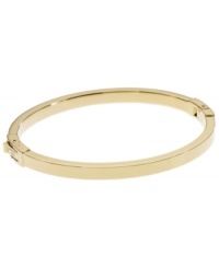 Dress up your look with a simple layer. Michael Kors thin polished bangle looks great solo, but is perfect for stacking! Crafted in gold tone mixed metal. Approximate width: 1/8 inch. Approximate diameter: 2-1/4 inches.