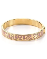MARC BY MARC JACOBS lends it's signature stamp to this 12-karat gold plated bangle. Slip this piece on your wrist to give your bracelet stack a branded touch. MARC BY MARC JACOBS lends it's signature stamp to this 12-karat gold plated bangle. Slip this piece on your wrist to give your bracelet stack a branded touch.