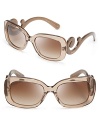 Go for Baroque in Prada's over-the-top sunglasses with statement-making arms.