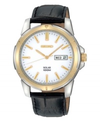 Traditionally handsome style combines with modern solar power in this watch by Seiko. Black croc-embossed leather strap and round stainless steel case with gold tone bezel, 39mm. White dial features applied gold tone stick indices, black minute track, day and date window at three o'clock, LumiBrite hands and logo. Solar-powered quartz movement. Water resistant to 100 meters. Three-year limited warranty. Traditionally handsome style combines with modern solar power in this watch by Seiko. Black croc-embossed leather strap and round stainless steel case with gold tone bezel, 39mm. White dial features applied gold tone stick indices, black minute track, day and date window at three o'clock, LumiBrite hands and logo. Solar-powered quartz movement. Water resistant to 100 meters. Three-year limited warranty.