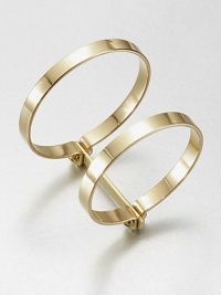 Two bold bangles, joined together, have an industrial screw-in design that enhances their simple drama.BrassDiameter, about 2.75Width, about 1.75Imported Two bold bangles, joined together, have an industrial screw-in design that enhances their simple drama.BrassDiameter, about 2.75Width, about 1.75Imported