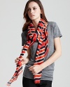 A large lightweight scarf with thick stripe print and self fringe edges.