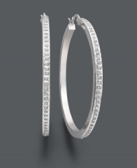 A sweet combination of traditional style and added glamour. These classic hoop earrings shine with the addition of sparkling diamond accents. Set in sterling silver. Approximate diameter: 2 inches. A sweet combination of traditional style and added glamour. These classic hoop earrings shine with the addition of sparkling diamond accents. Set in sterling silver. Approximate diameter: 2 inches.