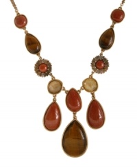 Bohemian bliss. Lucky Brand's earthy Y necklace features semi-precious teardrop and round-cut tiger's eye and gold sandstone with plastic and glass beaded accents. Set in gold tone mixed metal. Approximate length: 21 inches + 2-inch extender. Approximate drop: 3-3/8 inches. Bohemian bliss. Lucky Brand's earthy Y necklace features semi-precious teardrop and round-cut tiger's eye and gold sandstone with plastic and glass beaded accents. Set in gold tone mixed metal. Approximate length: 21 inches + 2-inch extender. Approximate drop: 3-3/8 inches.