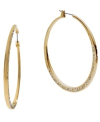 Don't be subtle, stand out! Michael Kors' shimmering hoop earrings feature a shiny gold tone mixed metal setting decorated at the bottom by sparkling crystals. Approximate diameter: 2 inches. Don't be subtle, stand out! Michael Kors' shimmering hoop earrings feature a shiny gold tone mixed metal setting decorated at the bottom by sparkling crystals. Approximate diameter: 2 inches.