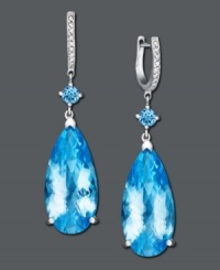 Sophisticated elegance in vibrant color. These dramatic drop earrings feature large blue topaz stones (38 ct. t.w.) accented by sparkling diamonds. Crafted in sterling silver. Approximate drop: 2 inches. Sophisticated elegance in vibrant color. These dramatic drop earrings feature large blue topaz stones (38 ct. t.w.) accented by sparkling diamonds. Crafted in sterling silver. Approximate drop: 2 inches.