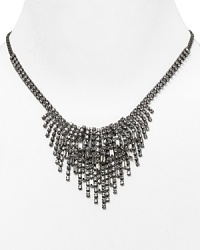 Standout in the sparkle department this grand Cara Accessories necklace, which features a bold cascade of crystal fringe, finished in gunmetal plate. Standout in the sparkle department this grand Cara Accessories necklace, which features a bold cascade of crystal fringe, finished in gunmetal plate.