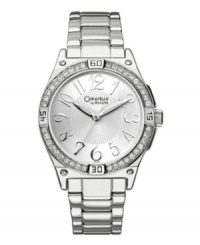 Make a stunning impression with this shining watch by Caravelle by Bulova. Silver tone mixed metal bracelet and round case with four lugs. Bezel crystallized with Swarovski elements. Silver tone dial with textured inner dial features applied silver tone numerals at markers, luminous hour and minute hands, sweeping second hand, and logo. Quartz movement. Water resistant to 30 meters. Two-year limited warranty. Make a stunning impression with this shining watch by Caravelle by Bulova. Silver tone mixed metal bracelet and round case with four lugs. Bezel crystallized with Swarovski elements. Silver tone dial with textured inner dial features applied silver tone numerals at markers, luminous hour and minute hands, sweeping second hand, and logo. Quartz movement. Water resistant to 30 meters. Two-year limited warranty.
