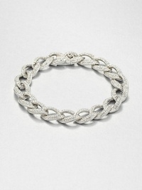 Tapered leaf-shaped links, encrusted with pavé crystals, form an elegantly simple chain bracelet with endless sparkle.CrystalRhodium platingLength, about 7¼Width, about ½Box-and-tongue claspImported Tapered leaf-shaped links, encrusted with pavé crystals, form an elegantly simple chain bracelet with endless sparkle.CrystalRhodium platingLength, about 7¼Width, about ½Box-and-tongue claspImported