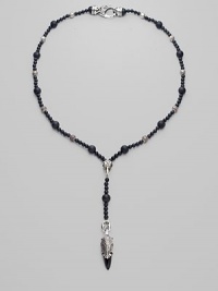 A strand of large and small black onyx beads, interspersed with textured sterling silver beads, with a Y-shaped drop, capped by a dramatic carved raven's head. Black onyx Sterling silver Length, about 15 Drop, about 4 Lobster clasp Imported A strand of large and small black onyx beads, interspersed with textured sterling silver beads, with a Y-shaped drop, capped by a dramatic carved raven's head. Black onyx Sterling silver Length, about 15 Drop, about 4 Lobster clasp Imported