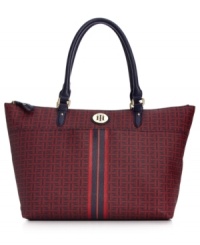 Live la vida logo with this signature print silhouette from Tommy Hilfiger. The classic tote design it adorned with golden hardware, monogram plaque and preppy center stripe, while the ultra-roomy interior is outfitted with plenty of pockets to keep essentials safe. Live la vida logo with this signature print silhouette from Tommy Hilfiger. The classic tote design it adorned with golden hardware, monogram plaque and preppy center stripe, while the ultra-roomy interior is outfitted with plenty of pockets to keep essentials safe.