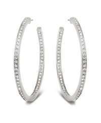 Stellar style fit for a celebrity. This elegant pair of silver tone mixed metal hoop earrings sparkles in clear Swarovski crystal pavé and reflects the light in a thousand facets. These unique earrings add a touch of sophistication to your look. Approximate diameter: 1-7/8 inches. Stellar style fit for a celebrity. This elegant pair of silver tone mixed metal hoop earrings sparkles in clear Swarovski crystal pavé and reflects the light in a thousand facets. These unique earrings add a touch of sophistication to your look. Approximate diameter: 1-7/8 inches.
