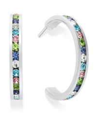 Traditions gives a sparkling boost to a simple pair of hoop earrings. A channel-set row of round-cut multicolored Swarovski crystals shines within a sterling silver setting. Earrings feature a post and stud backing. Approximate diameter: 3/4 inch. Traditions gives a sparkling boost to a simple pair of hoop earrings. A channel-set row of round-cut multicolored Swarovski crystals shines within a sterling silver setting. Earrings feature a post and stud backing. Approximate diameter: 3/4 inch.