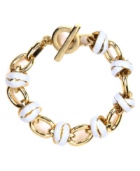Well-rounded elegance. This bracelet by AK Anne Klein features golden circle links accented with pretty ivory enamel. Crafted in gold tone mixed metal with a toggle closure. Approximate length: 7-1/2 inches. Well-rounded elegance. This bracelet by AK Anne Klein features golden circle links accented with pretty ivory enamel. Crafted in gold tone mixed metal with a toggle closure. Approximate length: 7-1/2 inches.