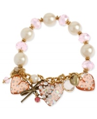 Charm your heart. Betsey Johnson's bracelet highlights pink faceted beads and glass pearls on a half-stretch chain. Bracelet is decorated with pink-colored lucite hearts with crystal accents, gold tone bow with pink-colored crystal accent and round crystal disc. Set in gold tone mixed metal. Approximate length: 7-1/2 inches. Charm your heart. Betsey Johnson's bracelet highlights pink faceted beads and glass pearls on a half-stretch chain. Bracelet is decorated with pink-colored lucite hearts with crystal accents, gold tone bow with pink-colored crystal accent and round crystal disc. Set in gold tone mixed metal. Approximate length: 7-1/2 inches.
