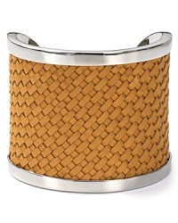 Tactile touches continue to be a major trend. Make the look day-right with this bold leather and silver tone plated cuff bracelet from MICHAEL Michael Kors. Tactile touches continue to be a major trend. Make the look day-right with this bold leather and silver tone plated cuff bracelet from MICHAEL Michael Kors.