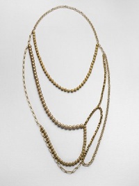 An artistic and modern design with faceted and smooth beads and various link chains in an abstract style. Glass and acrylic beadsGoldtone brassLength, about 47Slip-on styleImported An artistic and modern design with faceted and smooth beads and various link chains in an abstract style. Glass and acrylic beadsGoldtone brassLength, about 47Slip-on styleImported