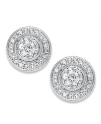 The perfect accessory comes full circle. Eliot Danori's stud earrings feature a circular design with set glass crystal accents. Set in rhodium-plated silver tone mixed metal. Approximate diameter: 3/8 inch. The perfect accessory comes full circle. Eliot Danori's stud earrings feature a circular design with set glass crystal accents. Set in rhodium-plated silver tone mixed metal. Approximate diameter: 3/8 inch.