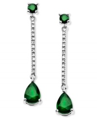 Glamorous green. These stunning sterling silver drop earrings highlight round and pear-cut emerald (1-9/10 ct. t.w.) and sparkling diamond accents. Approximate drop: 1-1/4 inches. Glamorous green. These stunning sterling silver drop earrings highlight round and pear-cut emerald (1-9/10 ct. t.w.) and sparkling diamond accents. Approximate drop: 1-1/4 inches.