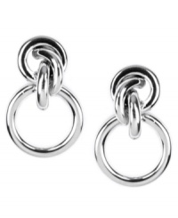 Valley Girl chic. AK Anne Klein revives a vintage doorknocker design with a modern twist with knot detail. Crafted in imitation rhodium-plated mixed metal. Approximate drop: 1 inch. Valley Girl chic. AK Anne Klein revives a vintage doorknocker design with a modern twist with knot detail. Crafted in imitation rhodium-plated mixed metal. Approximate drop: 1 inch.