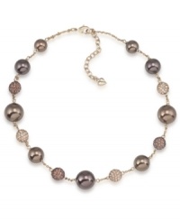 Lightweight yet luxe. Carolee's illusion necklace will have an elegant effect on your fall wardrobe. Made in gold tone mixed metal, it's adorned with glass pearls in a beautiful brown hue as well as sparkling fireball accents. Approximate length: 16 inches + 2-inch extender. Lightweight yet luxe. Carolee's illusion necklace will have an elegant effect on your fall wardrobe. Made in gold tone mixed metal, it's adorned with glass pearls in a beautiful brown hue as well as sparkling fireball accents. Approximate length: 16 inches + 2-inch extender.