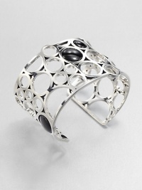 From the Regitze Collection. A striking, sculptural open cuff formed of cutout circles of gleaming sterling silver, dotted with discs of rich black agate.Black agateSterling silverDiameter, about 2¼Width, about 1¾Imported From the Regitze Collection. A striking, sculptural open cuff formed of cutout circles of gleaming sterling silver, dotted with discs of rich black agate.Black agateSterling silverDiameter, about 2¼Width, about 1¾Imported