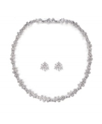 Celestially chic. Featuring a star motif, Swarovski's sparkling pavé crystal necklace and earrings set will add glamour to your holiday style. Set in silver tone mixed metal. Approximate necklace length: 15 inches. Approximate earring diameter: 1/2 inch. Celestially chic. Featuring a star motif, Swarovski's sparkling pavé crystal necklace and earrings set will add glamour to your holiday style. Set in silver tone mixed metal. Approximate necklace length: 15 inches. Approximate earring diameter: 1/2 inch.