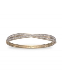 All the sparkle you love, with a twist. This stunning Swarovski bangle shines with clear crystal pave set in two bands of gold-plated mixed metal crossed at center. Approximate diameter: 3-1/4 inches. All the sparkle you love, with a twist. This stunning Swarovski bangle shines with clear crystal pave set in two bands of gold-plated mixed metal crossed at center. Approximate diameter: 3-1/4 inches.