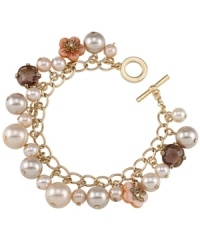 Pink perfection. Carolee's pretty glass pearl charm bracelet features ivory and peach hues, along with petite flower charms. Chain and toggle clasp crafted in 12k gold-plated mixed metal. Approximate length: 8 inches. Pink perfection. Carolee's pretty glass pearl charm bracelet features ivory and peach hues, along with petite flower charms. Chain and toggle clasp crafted in 12k gold-plated mixed metal. Approximate length: 8 inches.
