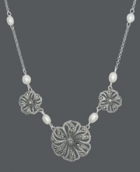 Create a neckline-embracing frame in intricate floral. It's easy to spruce up your spring wardrobe with this effortless style from Genevieve & Grace. Three filigree flowers glimmer with the addition of marcasite and shimmery cultured freshwater pearl accents (4-6 mm). Set in sterling silver. Approximate length: 17 inches. Create a neckline-embracing frame in intricate floral. It's easy to spruce up your spring wardrobe with this effortless style from Genevieve & Grace. Three filigree flowers glimmer with the addition of marcasite and shimmery cultured freshwater pearl accents (4-6 mm). Set in sterling silver. Approximate length: 17 inches.
