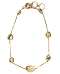 It's a gold rush! This chic necklace by Jones New York features nugget stones, some embellished with glass accents. Crafted in worn gold tone mixed metal with a toggle bar closure. Approximate length: 18 inches + 2-inch extender. It's a gold rush! This chic necklace by Jones New York features nugget stones, some embellished with glass accents. Crafted in worn gold tone mixed metal with a toggle bar closure. Approximate length: 18 inches + 2-inch extender.