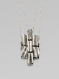 Sculpture to wear, this distinctive cross-shaped pendant is formed of elongated silvertone beads with golden accents for a striking effect.Silvertone and goldtoneLength, about 30Slip-on stylingMade in USA Sculpture to wear, this distinctive cross-shaped pendant is formed of elongated silvertone beads with golden accents for a striking effect.Silvertone and goldtoneLength, about 30Slip-on stylingMade in USA