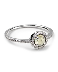 A checkerboard, dome cut center stone with talon prongs is surrounded in sparkling CZ stones on this small-but-statement-making Crislu ring. A checkerboard, dome cut center stone with talon prongs is surrounded in sparkling CZ stones on this small-but-statement-making Crislu ring.