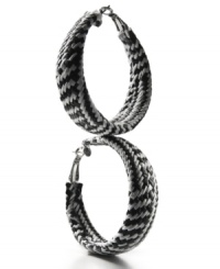 Practice contrast. A striking design made from braided black and white plastic vinyl make these Style&co. hoop earrings a fashionista's fave. Setting and lever clasp crafted in mixed metal. Approximate diameter: 2-1/2 inches. Practice contrast. A striking design made from braided black and white plastic vinyl make these Style&co. hoop earrings a fashionista's fave. Setting and lever clasp crafted in mixed metal. Approximate diameter: 2-1/2 inches.