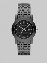 A sleek design with a black check etched dial. Quartz movement Water resistant to 5 ATM Round ion-plated stainless steel case, 34mm (1.3) Smooth bezel Black dial Bar hour markers Date display at 3 o'clock Second hand Ceramic check link bracelet, 18mm wide (0.7) Made in Switzerland A sleek design with a black check etched dial. Quartz movement Water resistant to 5 ATM Round ion-plated stainless steel case, 34mm (1.3) Smooth bezel Black dial Bar hour markers Date display at 3 o'clock Second hand Ceramic check link bracelet, 18mm wide (0.7) Made in Switzerland
