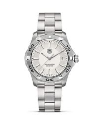 The Aquaracer from TAG Heuer features all six of TAG Heuer's features of a professional sports watch, including sapphire crystal, luminescent markers, screw-in crown, unidirectional rotating bezel, a double safety clasp and 300M water resistance. This model features a silver dial and steel bracelet. The Aquaracer from TAG Heuer features all six of TAG Heuer's features of a professional sports watch, including sapphire crystal, luminescent markers, screw-in crown, unidirectional rotating bezel, a double safety clasp and 300M water resistance. This model features a silver dial and steel bracelet.