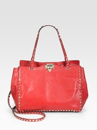 A roomy carryall in luxurious leather accented with pyramid studs for an extremely elegant design.Double top handles, 8 dropDetachable shoulder strap, 19½ dropFlip-lock closureOne inside zip pocketTwo inside open pocketsCotton lining13W X 9½H X 5DMade in Italy A roomy carryall in luxurious leather accented with pyramid studs for an extremely elegant design.Double top handles, 8 dropDetachable shoulder strap, 19½ dropFlip-lock closureOne inside zip pocketTwo inside open pocketsCotton lining13W X 9½H X 5DMade in Italy